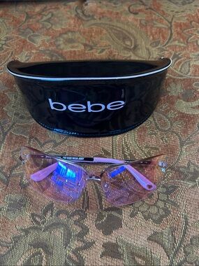 Juicy Couture Pink Rimless Sunglasses with Light Pink Temples includes bebe case